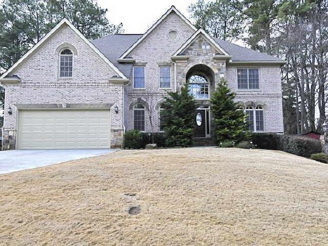 1812 Briarlake Circle Decatur, GA 30033 - Photo 1 of 1 a front view of a house with a yard and garage