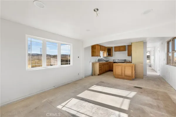 a view of a livingroom with furniture and windows