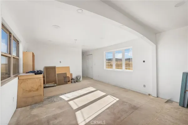 a kitchen with stainless steel appliances granite countertop a stove and a refrigerator