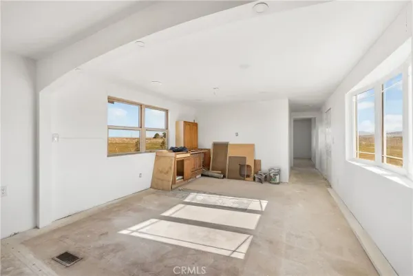 a kitchen that has a sink and a stove in it