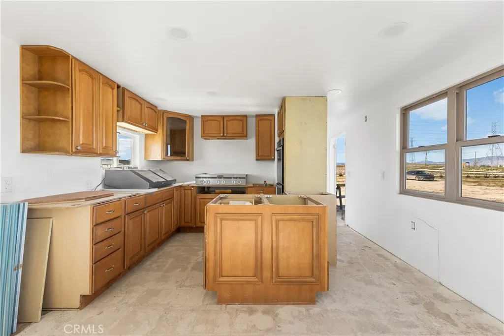 0 Bellbird Place Lancaster, CA 93534 - Photo 18 of 44 a kitchen that has a sink and a stove in it