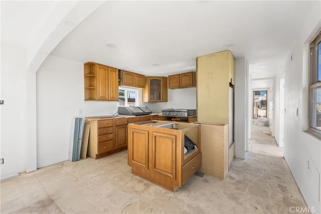 0 Bellbird Place Lancaster, CA 93534 - Photo 19 of 44 a kitchen with stainless steel appliances granite countertop a refrigerator and a stove
