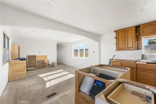 a kitchen with a sink dishwasher and cabinets