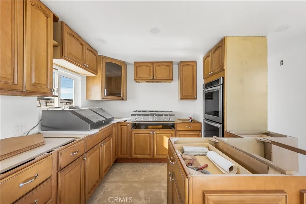 0 Bellbird Place Lancaster, CA 93534 - Photo 21 of 44 a kitchen that has a sink and a stove top oven