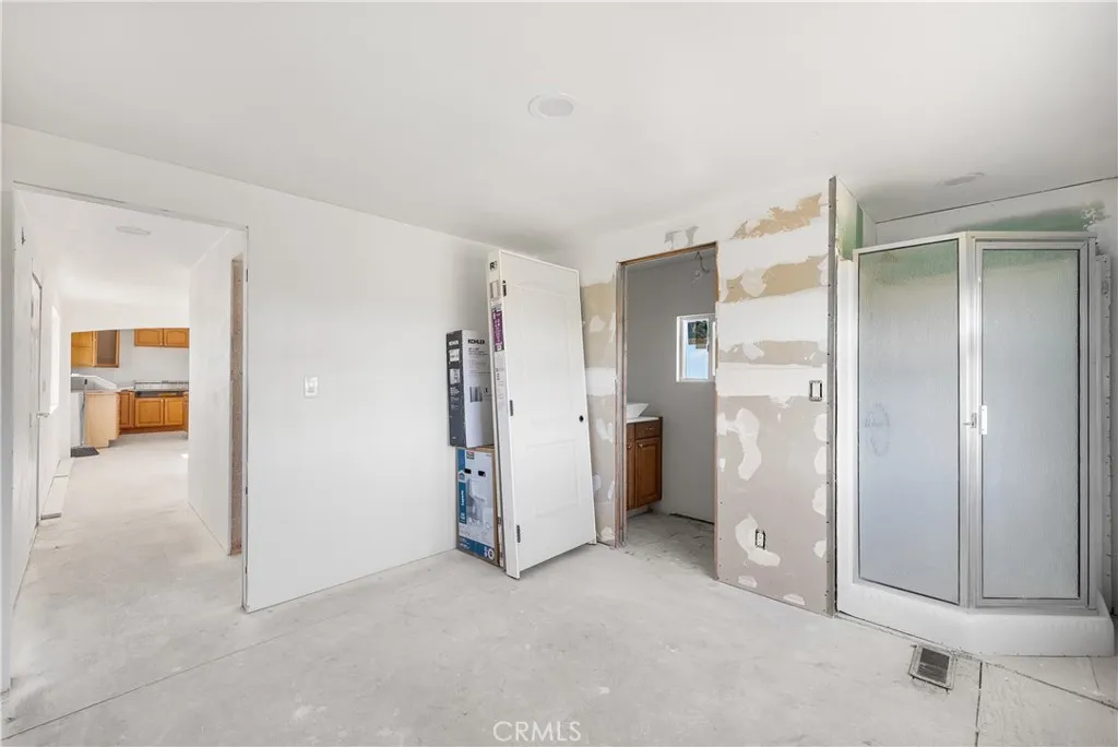 0 Bellbird Place Lancaster, CA 93534 - Photo 24 of 44 an empty room with a cabinet and mirrors