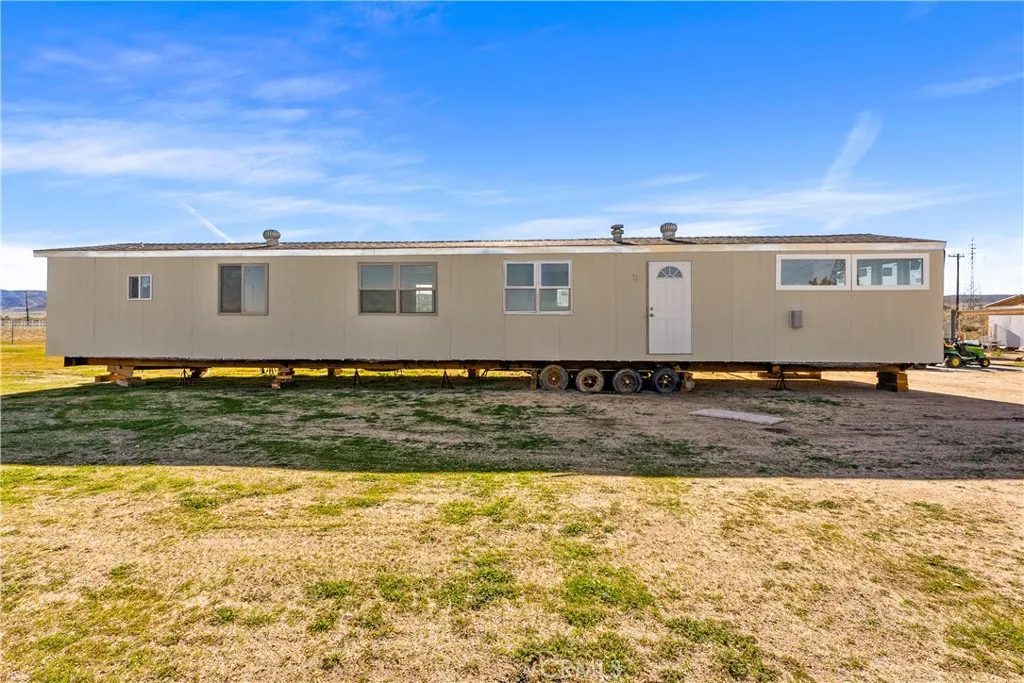 0 Bellbird Place Lancaster, CA 93534 - Photo 34 of 44 a view of a house with a yard