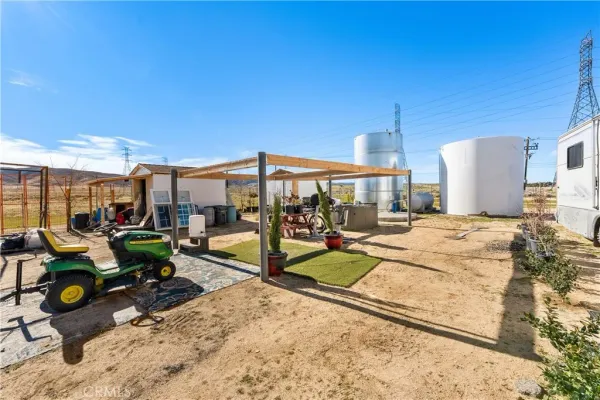 a view of a backyard with sitting area