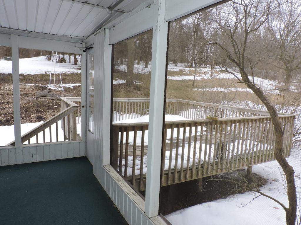 4894 Brookview Road Rockford, IL 61107 - Photo 21 of 21 a view of a porch with a small deck