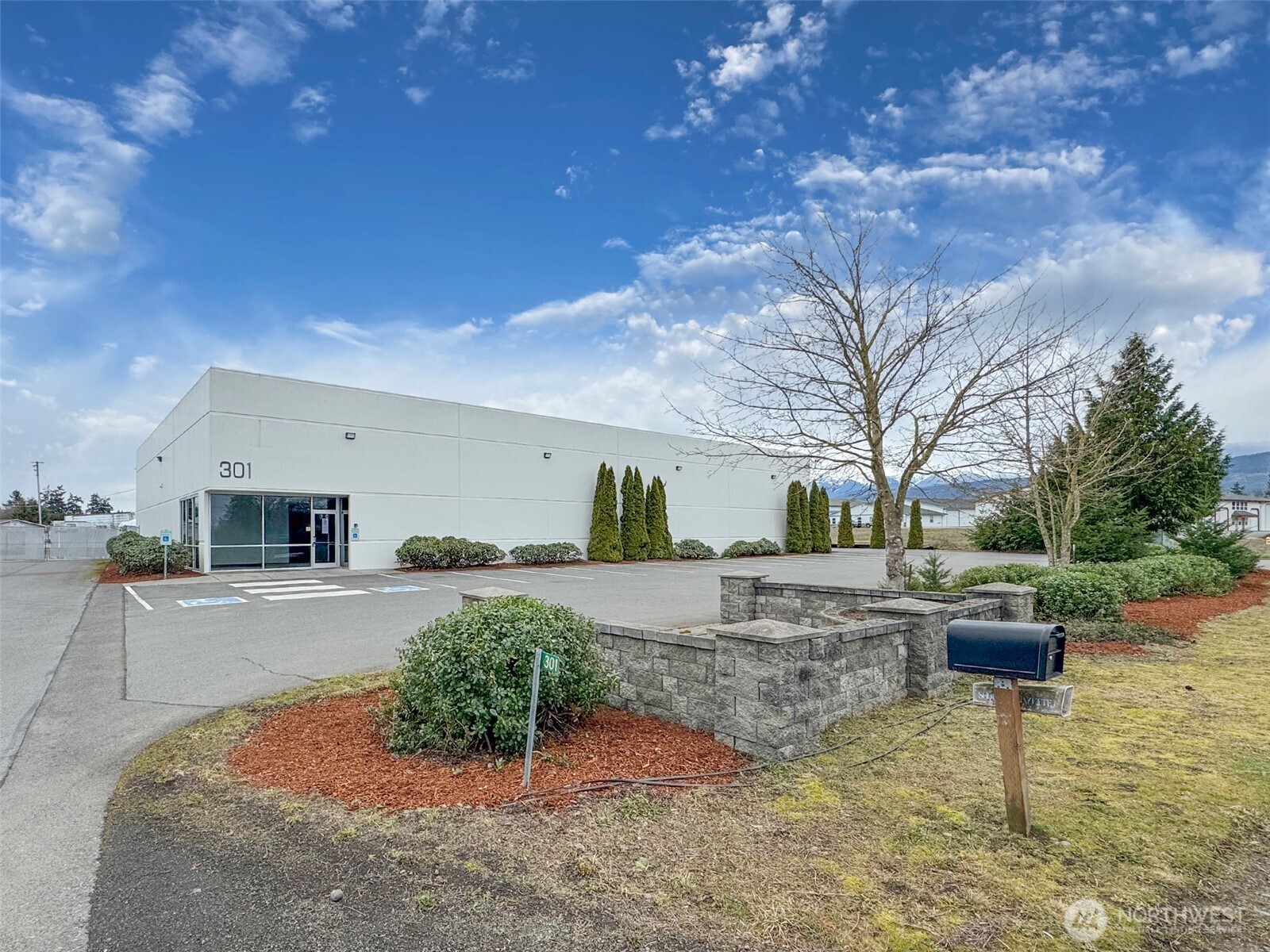 301 Business Park Loop Carlsborg, WA 98382 - Photo 11 of 36 a backyard of a house with yard barbeque oven and outdoor seating