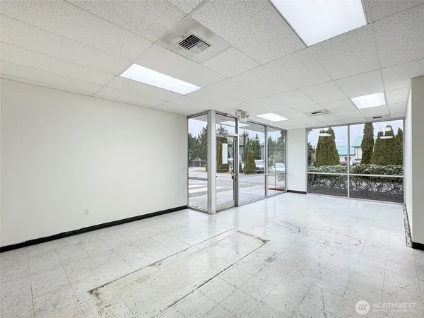 a view of a livingroom with furniture and a window