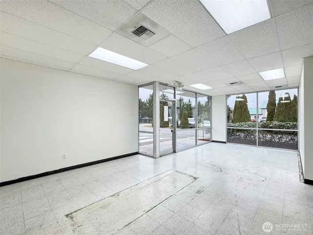 a view of a livingroom with furniture and a window
