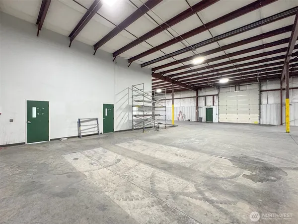 a bathroom with a granite countertop sink a mirror and a shower