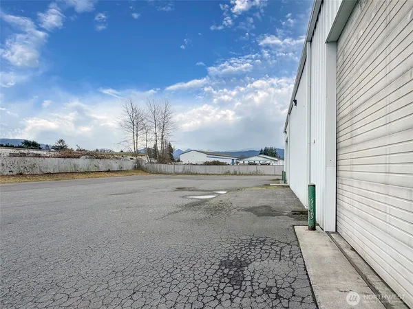 aerial view of a house with a yard