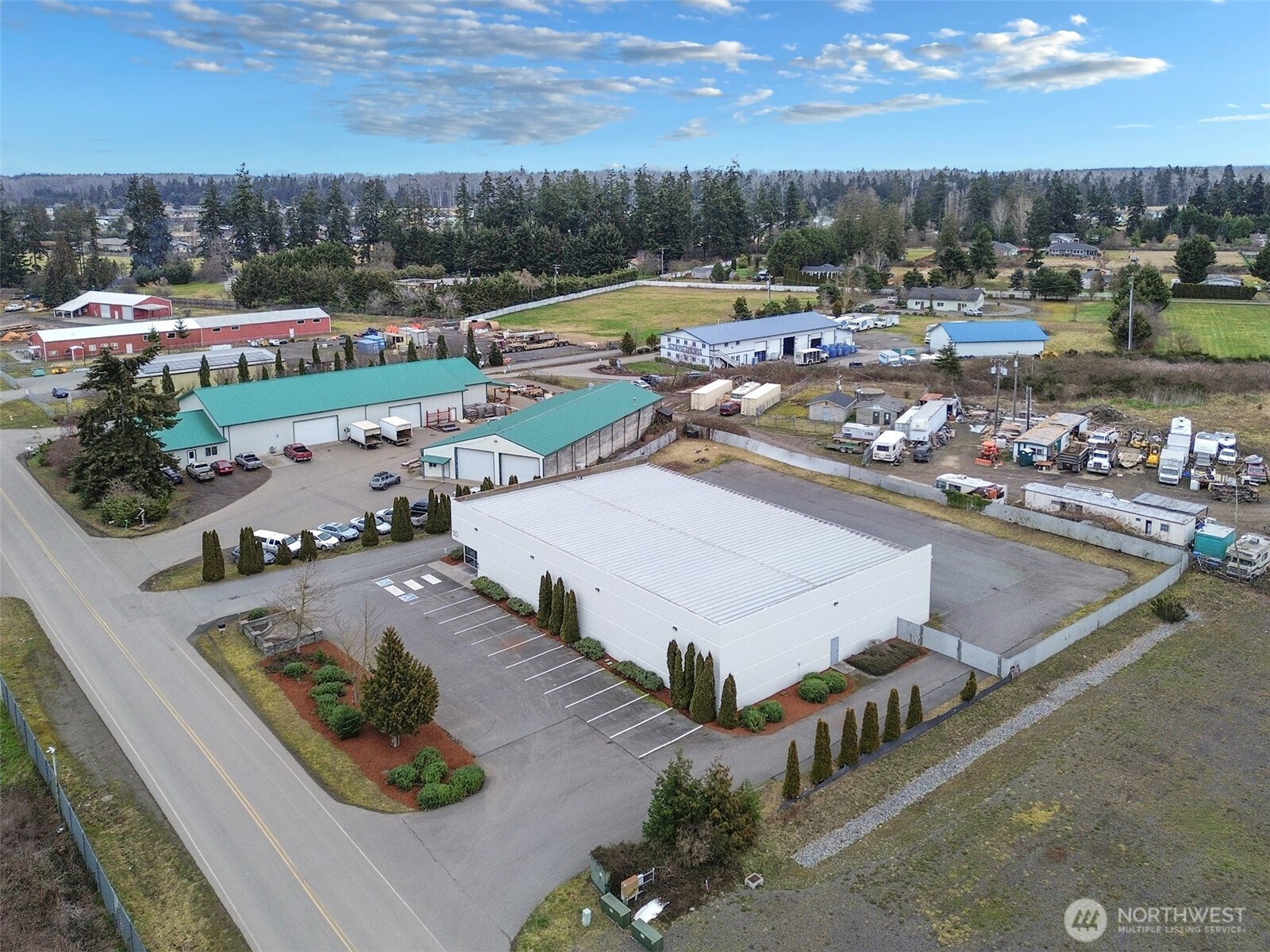301 Business Park Loop Carlsborg, WA 98382 - Photo 8 of 36 an aerial view of a house with swimming pool and outdoor seating