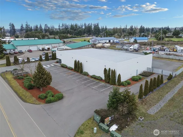 a view of a road with a building in the background