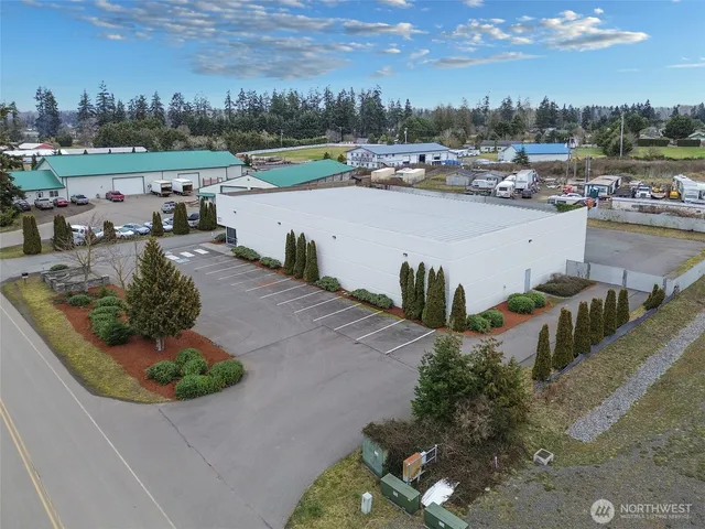 a view of a road with a building in the background