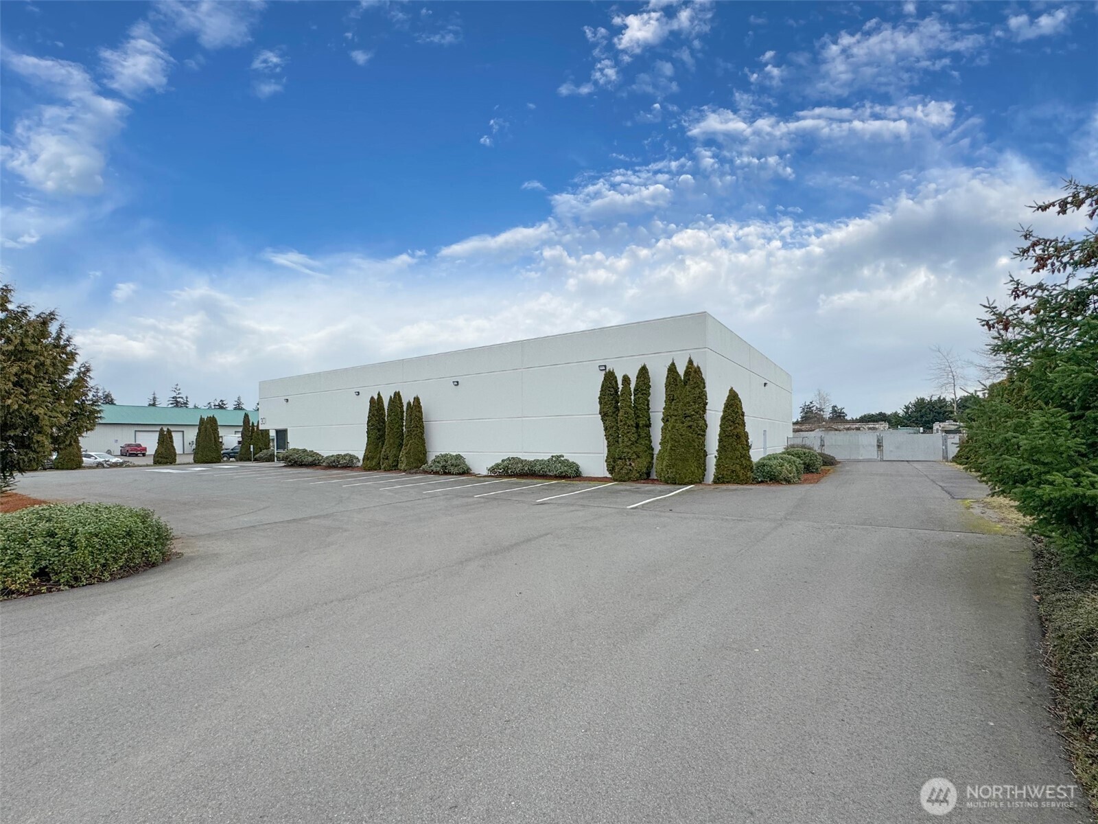 301 Business Park Loop Carlsborg, WA 98382 - Photo 10 of 36 a view of a road with a building in the background
