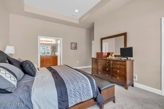 a bathroom with a shower and a sink