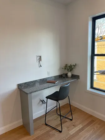 a workspace with furniture and window