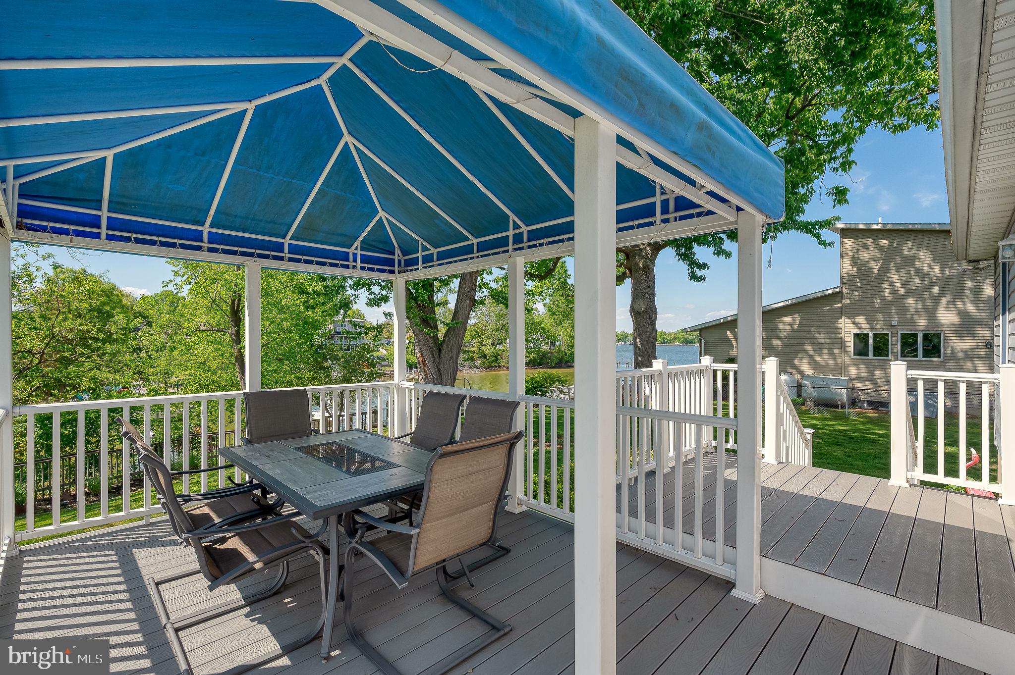 2222 Monocacy Road Essex, MD 21221 - Photo 35 of 70 Charming deck with blue canopy retreat.