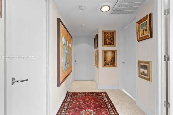 a view of a hallway with front door