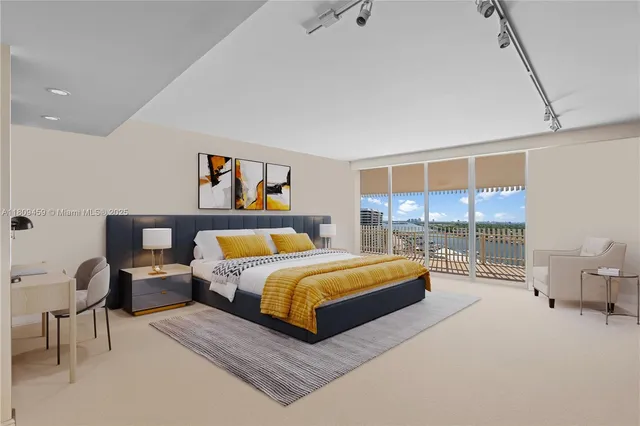 a bedroom with a bed and large window