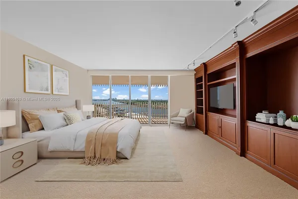 a spacious bedroom with a large bed and a large window