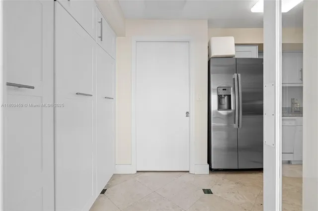 a view of a refrigerator in kitchen