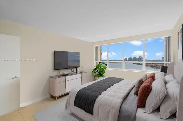 a bed room with a bed and a television