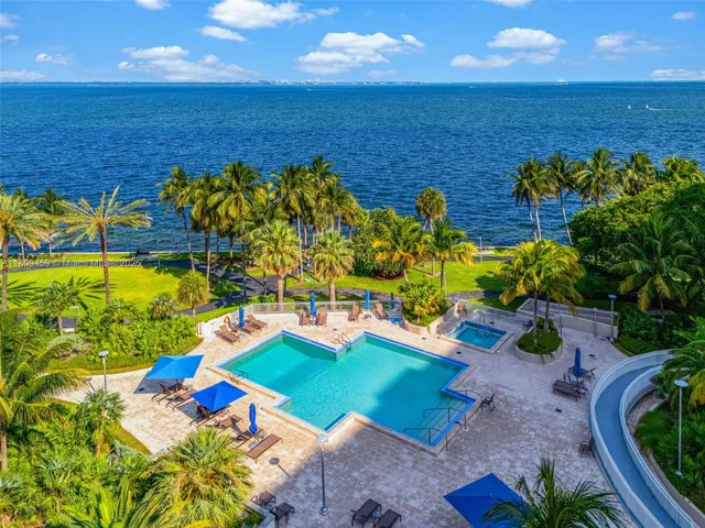 a view of a swimming pool with an ocean view