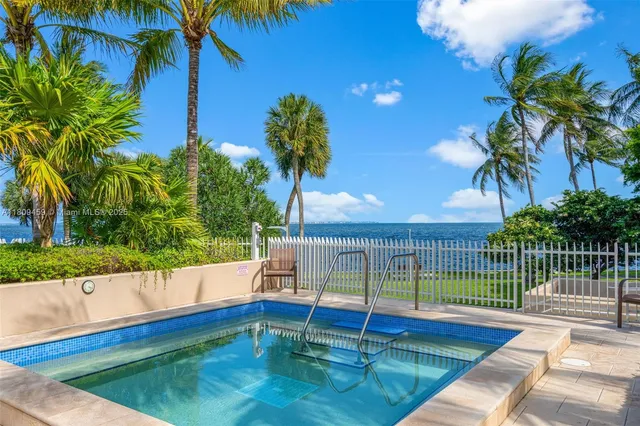 a view of a backyard with a small pool