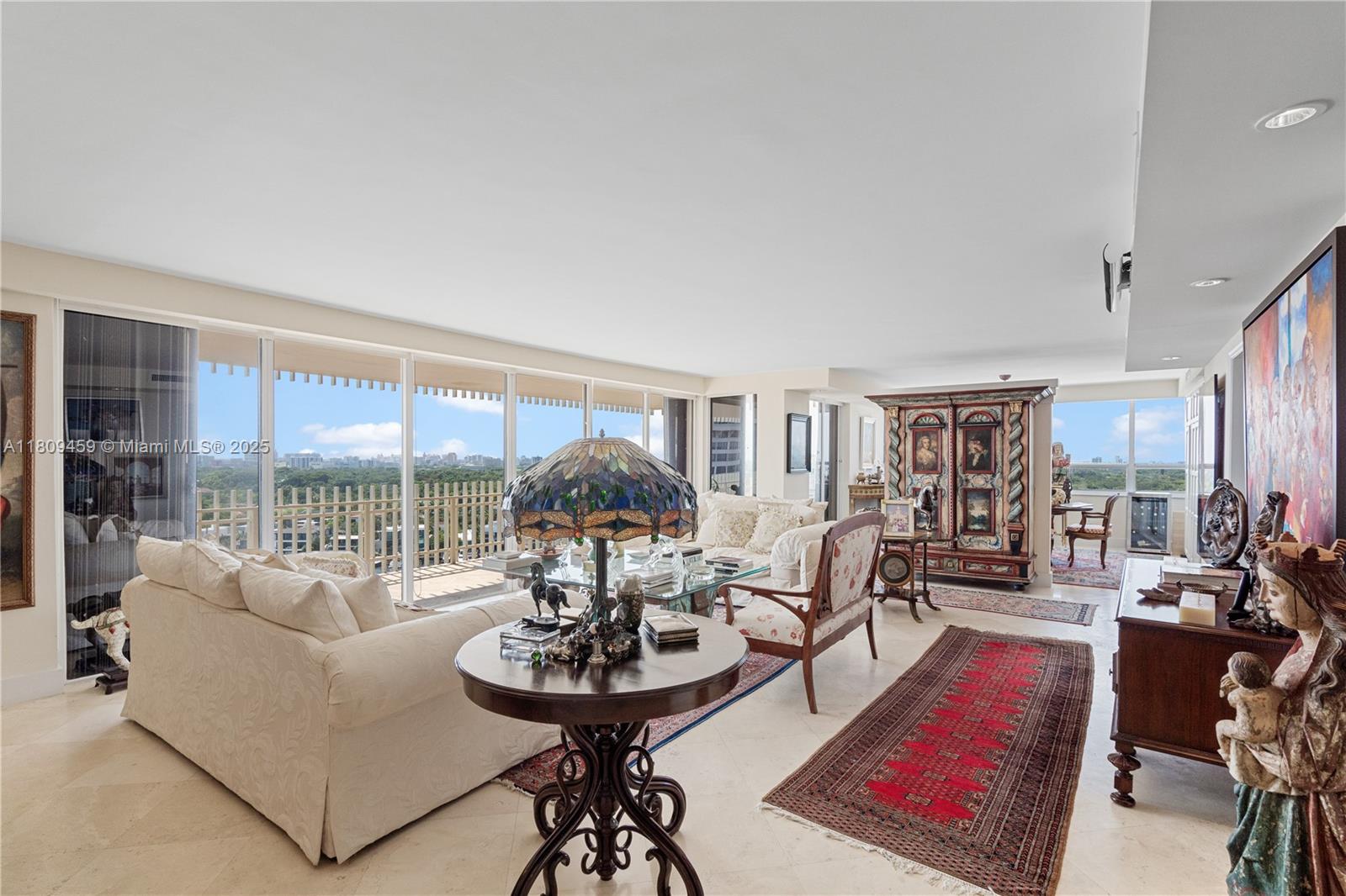 3 Grove Isle Drive, Unit C1610 Miami, FL 33133 - Photo 3 of 33 a living room with furniture and a large window