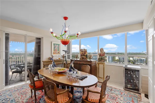 a view of a dining room with furniture window and outside view