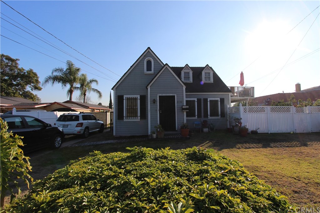 2132 East 126th Street Compton, CA 90222 - Photo 1 of 1 a front view of a house with a garden