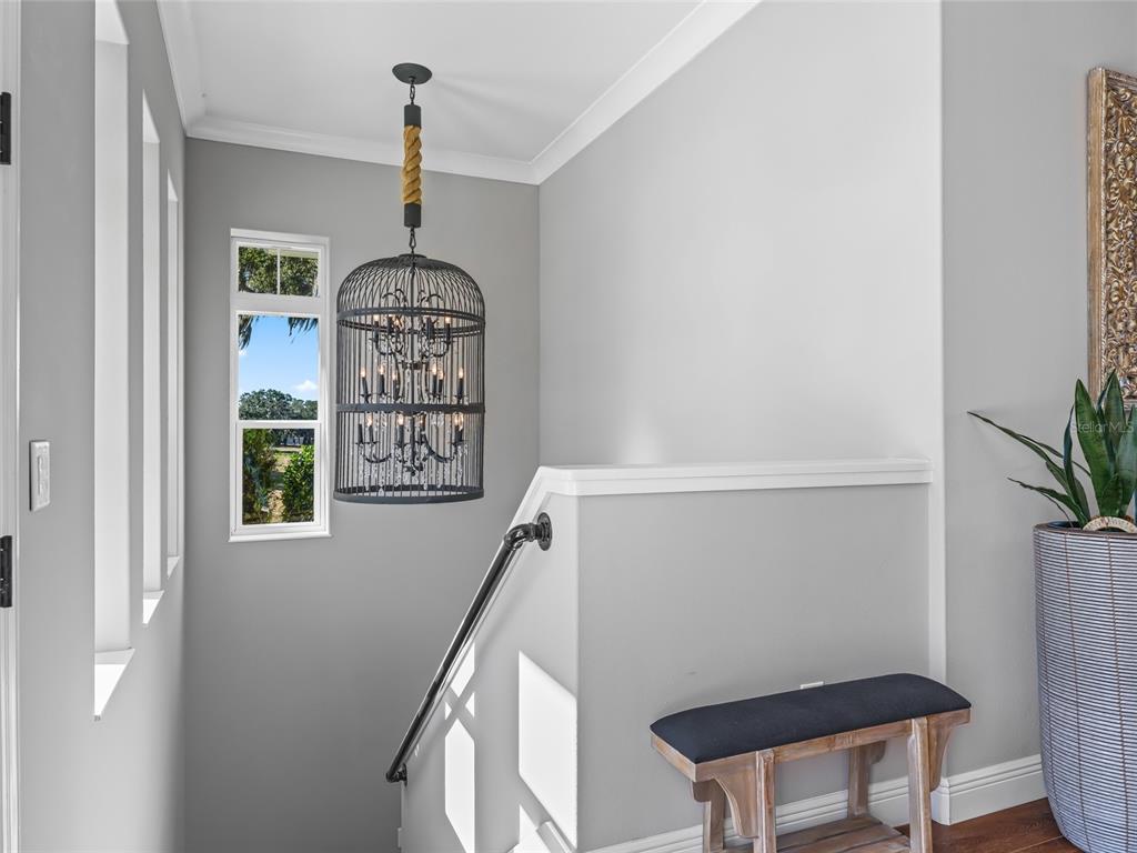 12943 Southeast Sunset Harbor Road Weirsdale, FL 32195 - Photo 51 of 87 a view of a hallway with windows and entryway