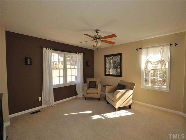 7804 Nugget Lane Raleigh, NC 27615 - Photo 2 of 10 a living room with furniture and a window
