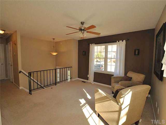 7804 Nugget Lane Raleigh, NC 27615 - Photo 3 of 10 a living room with furniture and a window