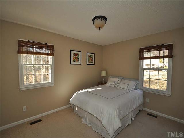 7804 Nugget Lane Raleigh, NC 27615 - Photo 6 of 10 a bedroom with a bed and a window