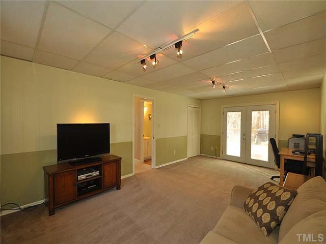 7804 Nugget Lane Raleigh, NC 27615 - Photo 8 of 10 a bedroom with furniture and a flat screen tv