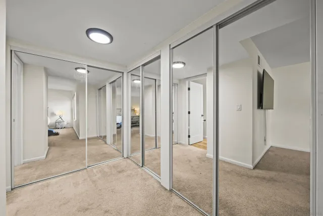 a bathroom with a shower and a glass door