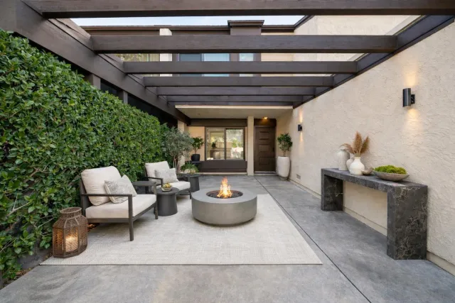 a living room with furniture and a potted plant