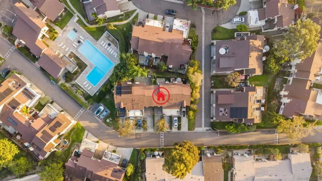 an aerial view of multi story residential apartment building with yard