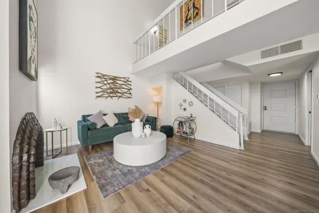 a living room with furniture and a table