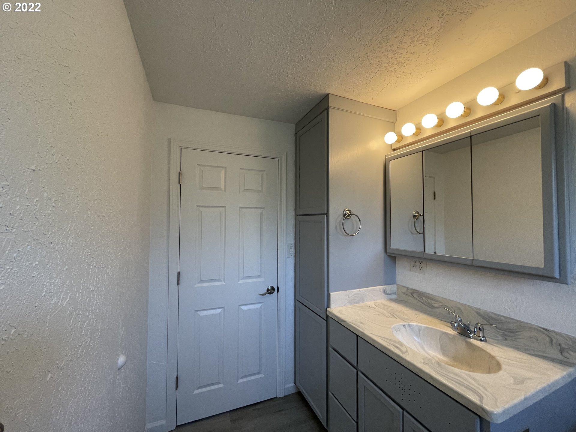 616 32nd Street Springfield, OR 97478 - Photo 21 of 28 a bathroom with a sink vanity and a mirror