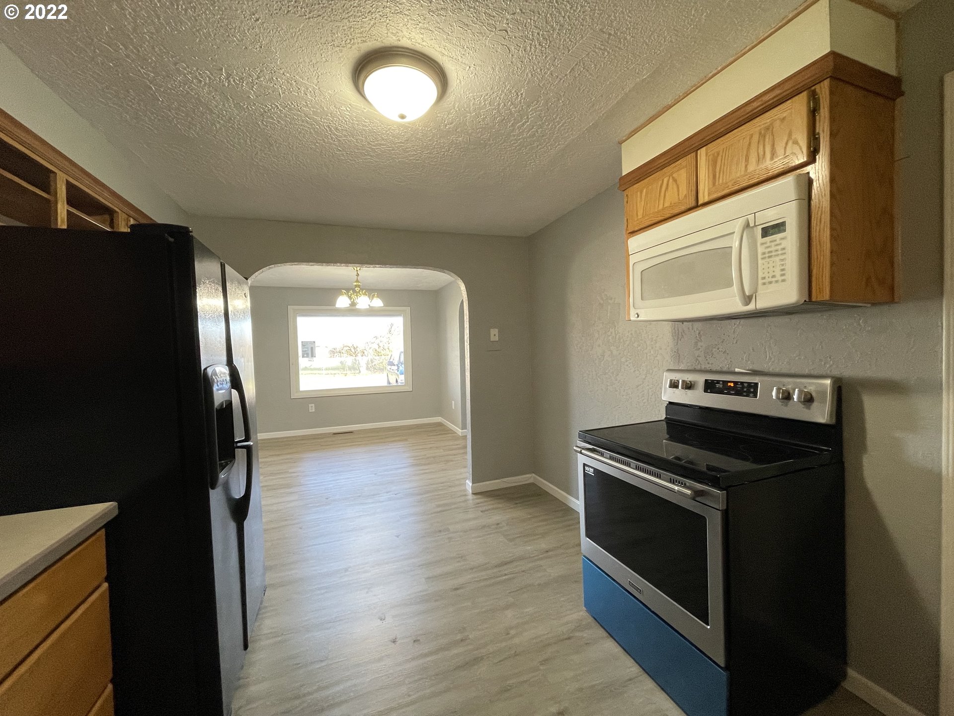 616 32nd Street Springfield, OR 97478 - Photo 7 of 28 a kitchen with a stove and a refrigerator