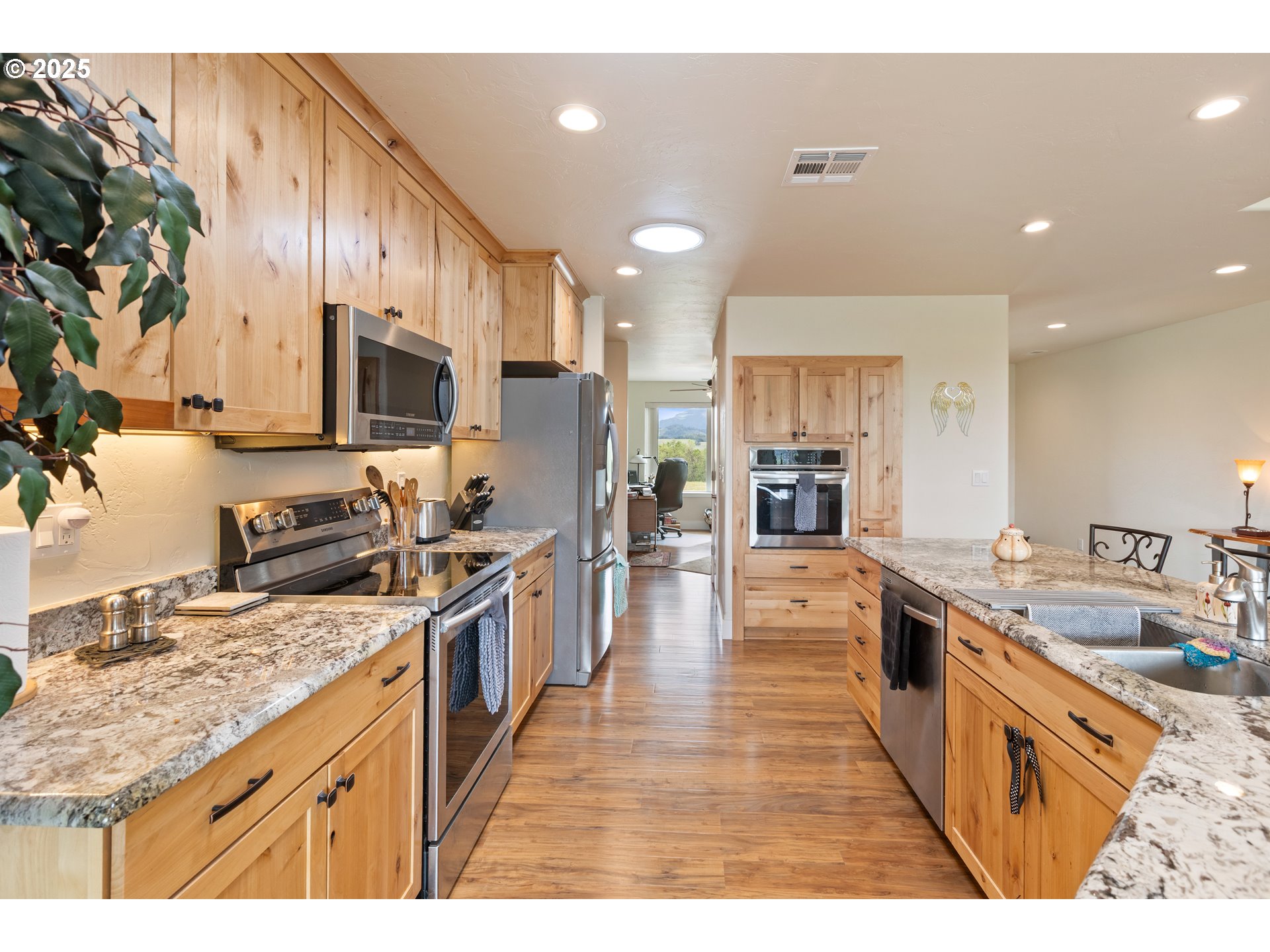 910 Swallow Avenue Sutherlin, OR 97479 - Photo 13 of 44 a large kitchen with stainless steel appliances lots of counter top space