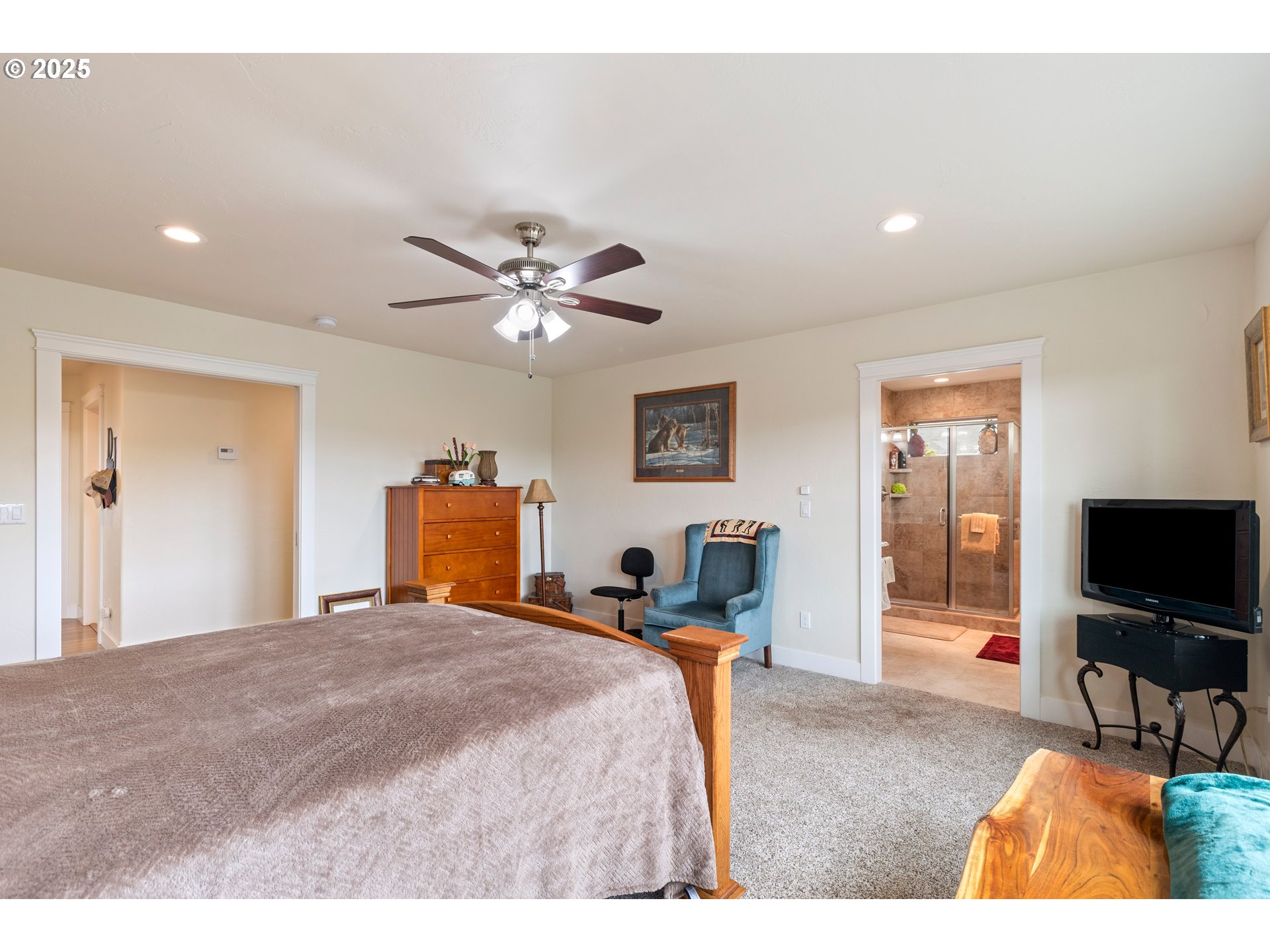 910 Swallow Avenue Sutherlin, OR 97479 - Photo 20 of 44 a bedroom with a bed and a flat screen tv