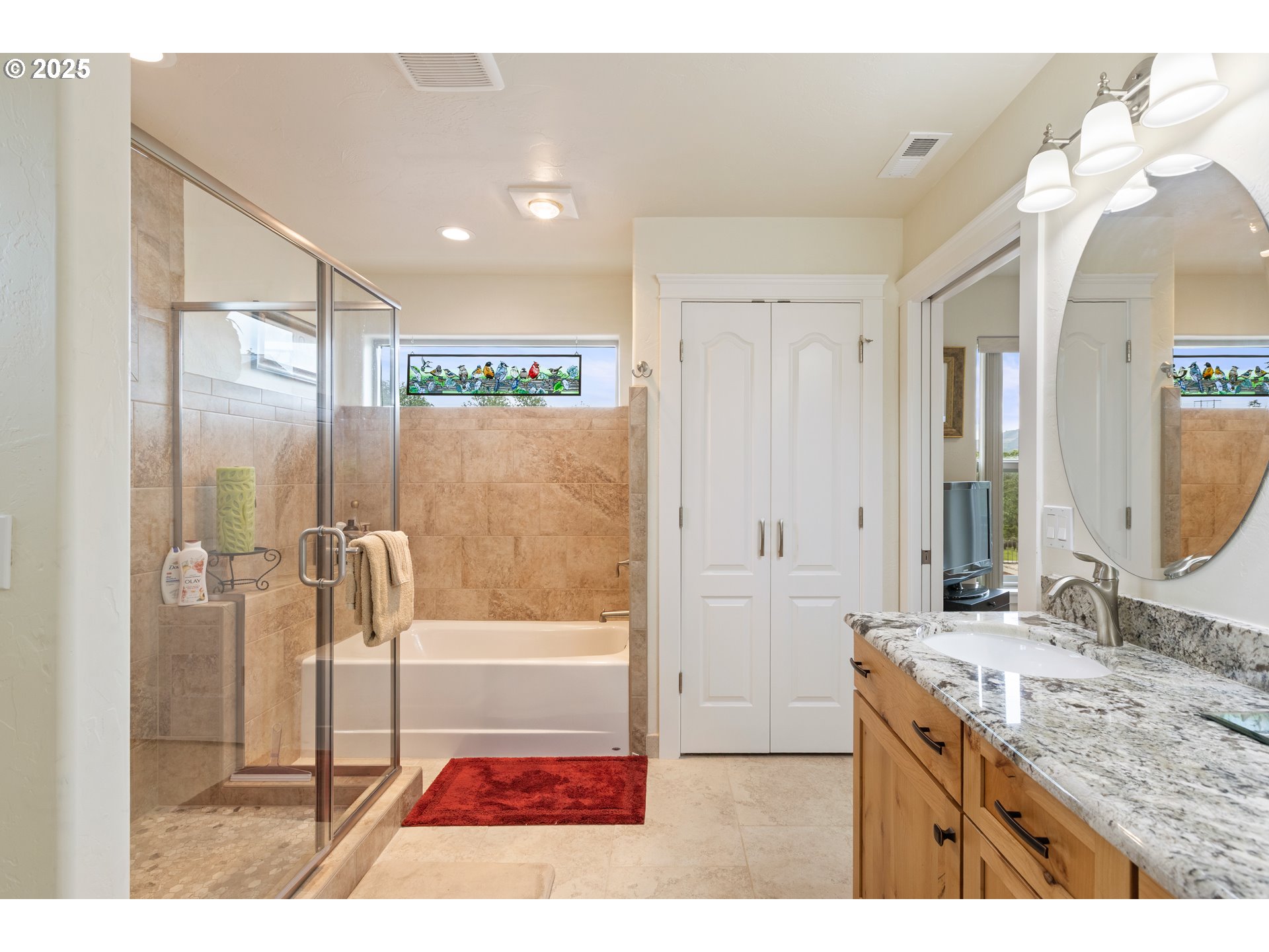 910 Swallow Avenue Sutherlin, OR 97479 - Photo 22 of 44 a bathroom with a granite countertop sink mirror and a bath tub