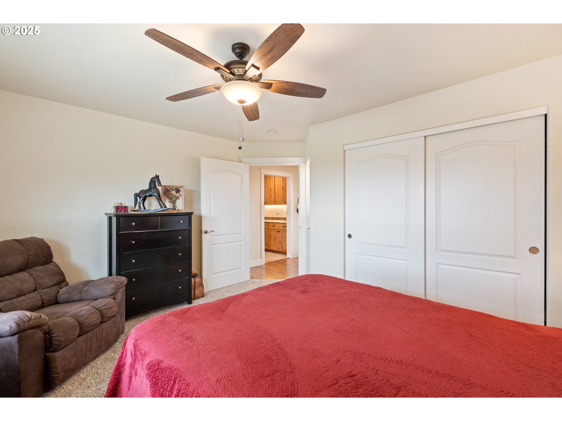 910 Swallow Avenue Sutherlin, OR 97479 - Photo 27 of 44 a bedroom with a bed and a chandelier
