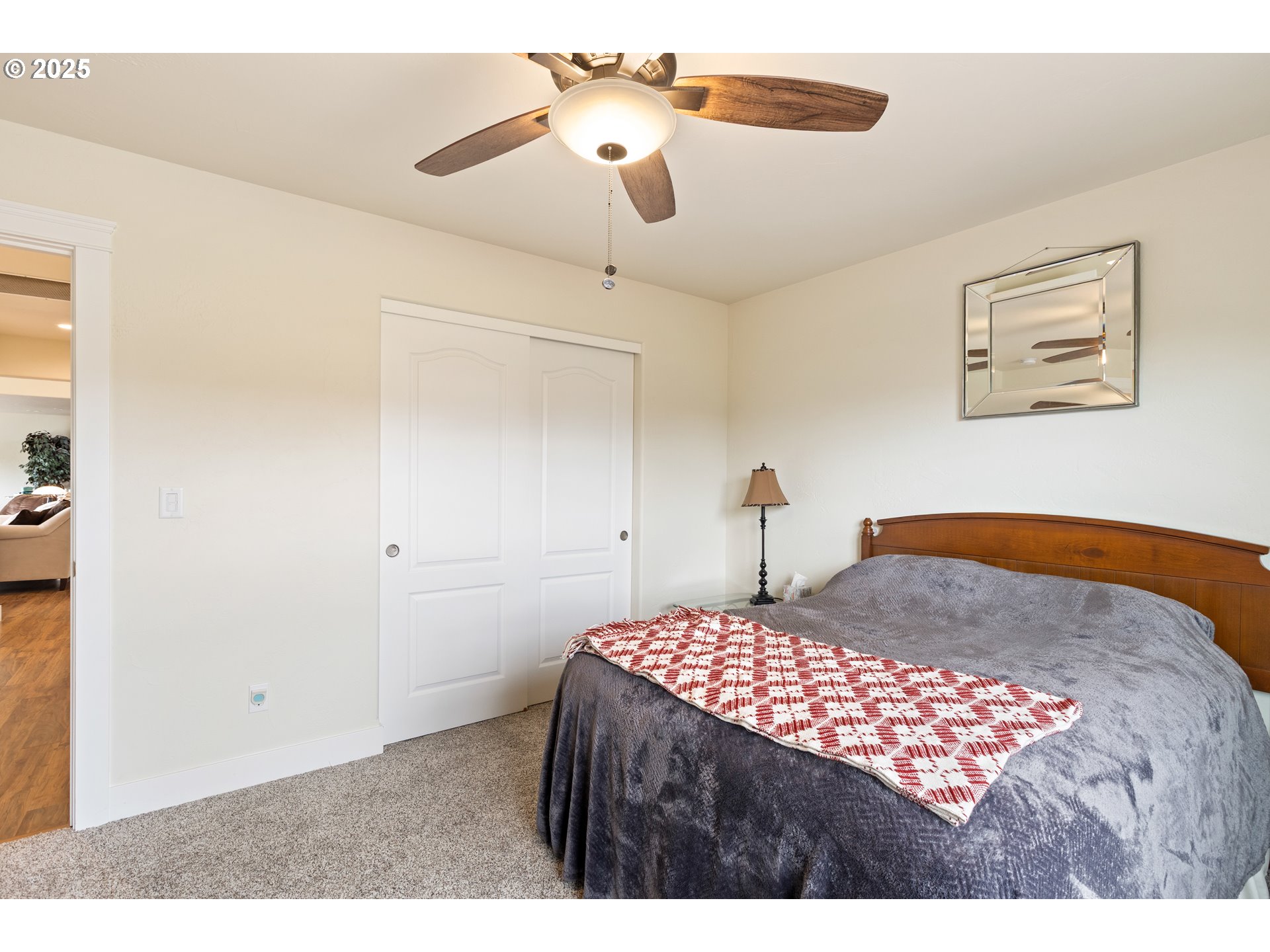 910 Swallow Avenue Sutherlin, OR 97479 - Photo 30 of 44 a bedroom with a large bed and a chandelier